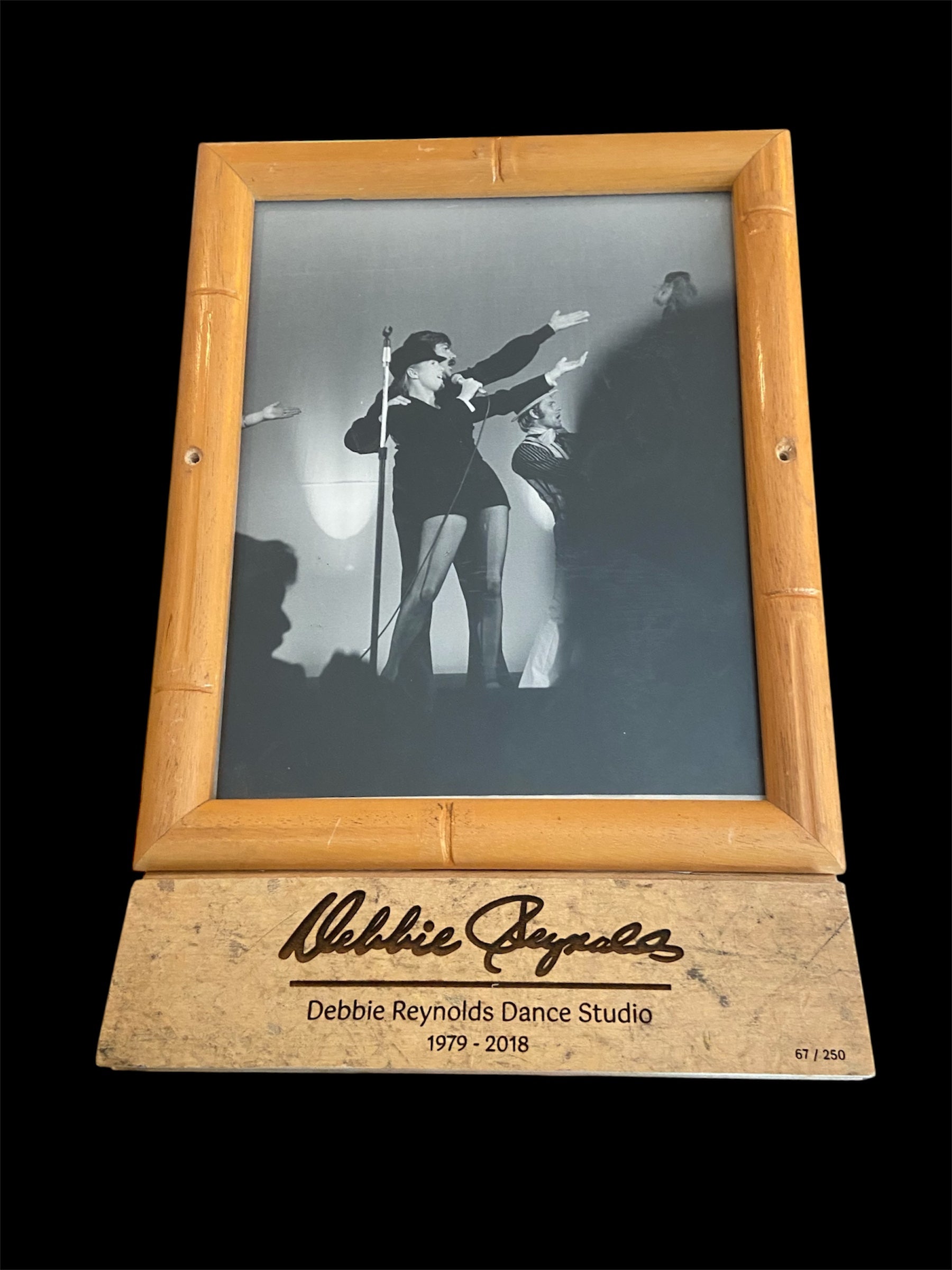 DEBBIE REYNOLDS DANCE STUDIO FRAME W/ FLOOR PIECE SIGNED BY TODD FEATURING ORIGINAL 8X10 OF DEBBIE & RIP TAYLOR IN LAS VEGAS IN THE EARLY 70S